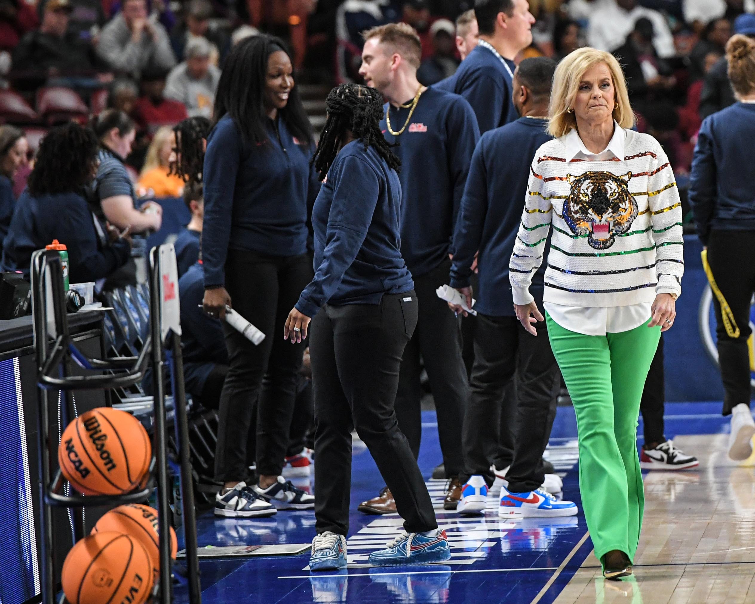 Louisiana State University Coach Kim Mulkey walks on the court before the game with Ole Miss in the SEC Women's Basketball Tournament game at the Bon Secours Wellness Arena in Greenville, S.C. Saturday, March 9, 2024.