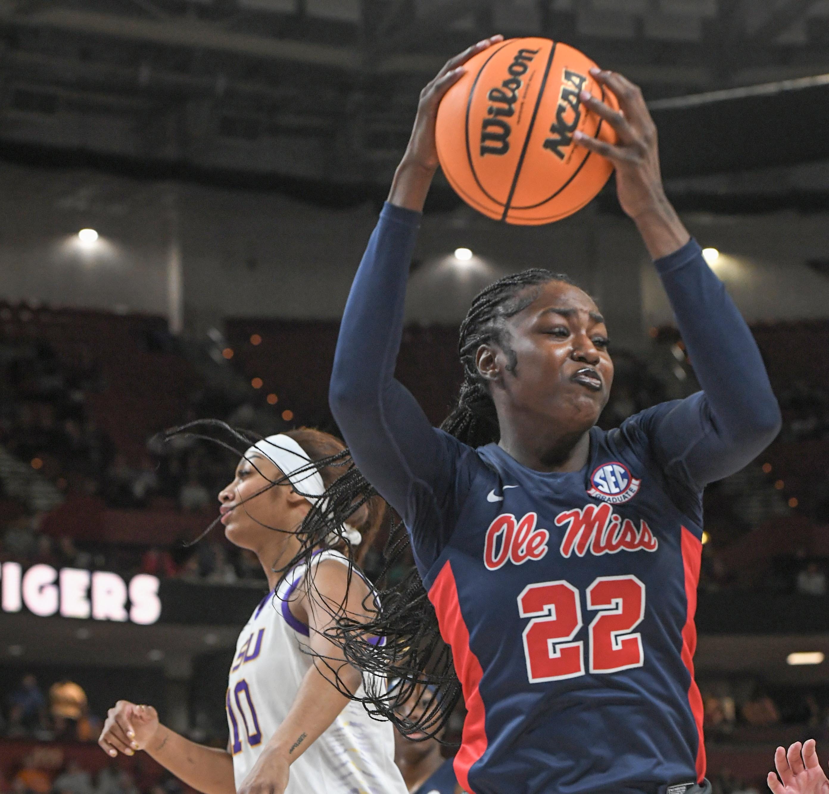 Ole Miss forward Tyra Singleton (22) rebounds near Louisiana State University forward Angel Reese (10) during the first quarter of the SEC Women's Basketball Tournament game at the Bon Secours Wellness Arena in Greenville, S.C. Saturday, March 9, 2024.