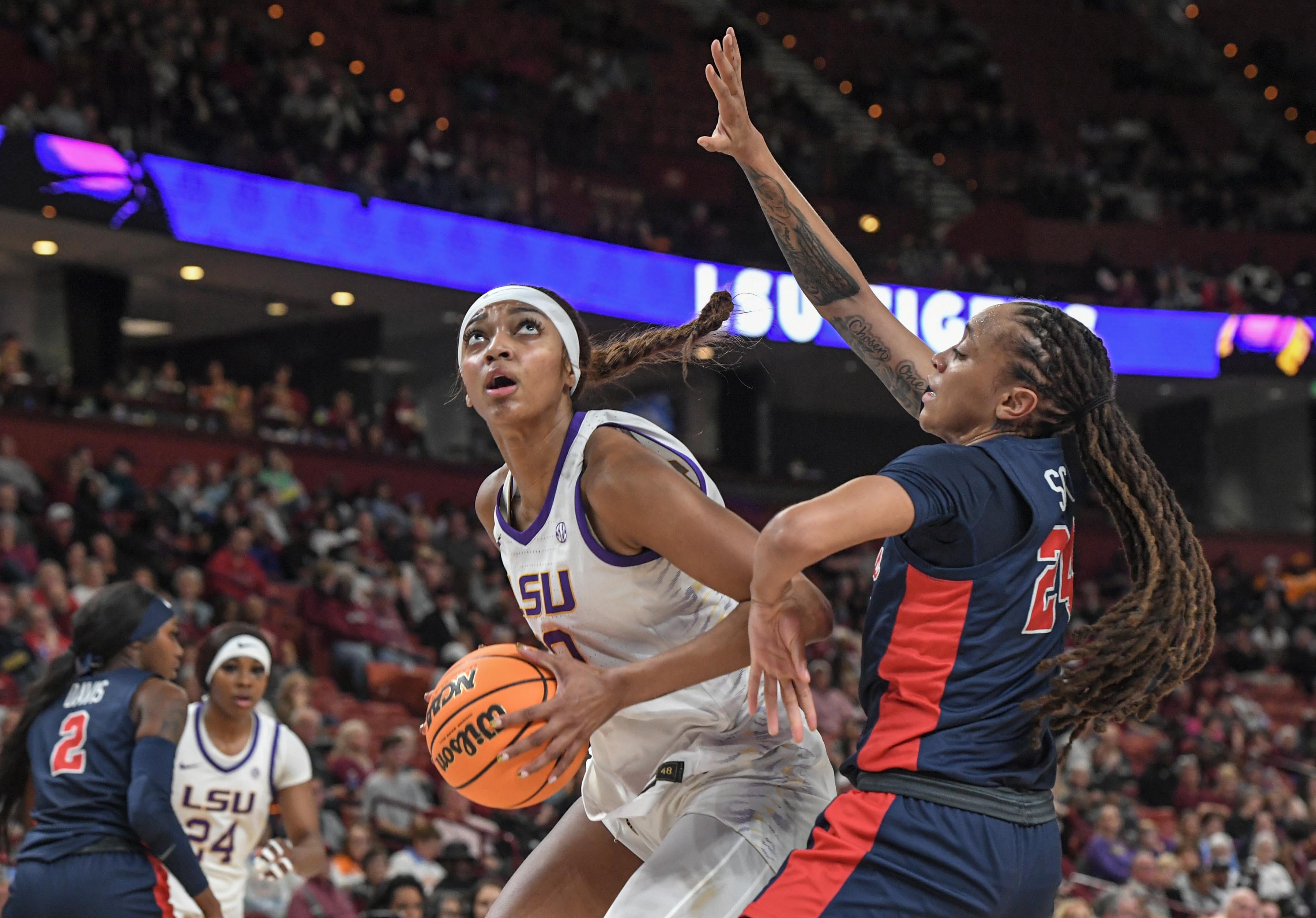 Louisiana State University forward Angel Reese (10) shoots the ball near Ole Miss Madison Scott (24) during the second quarter of the SEC Women's Basketball Tournament game at the Bon Secours Wellness Arena in Greenville, S.C. Saturday, March 9, 2024.