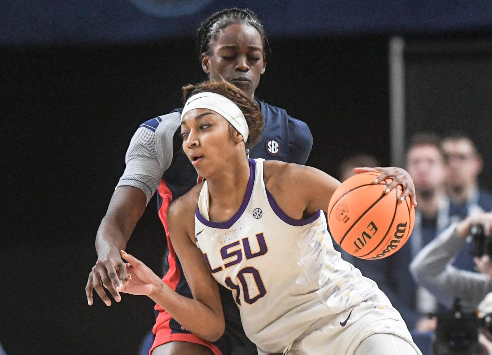 Louisiana State University forward Angel Reese (10) dribbles near Ole Miss forward Tyra Singleton (22) during the fourth quarter of the SEC Women's Basketball Tournament game at the Bon Secours Wellness Arena in Greenville, S.C. Saturday, March 9, 2024.
