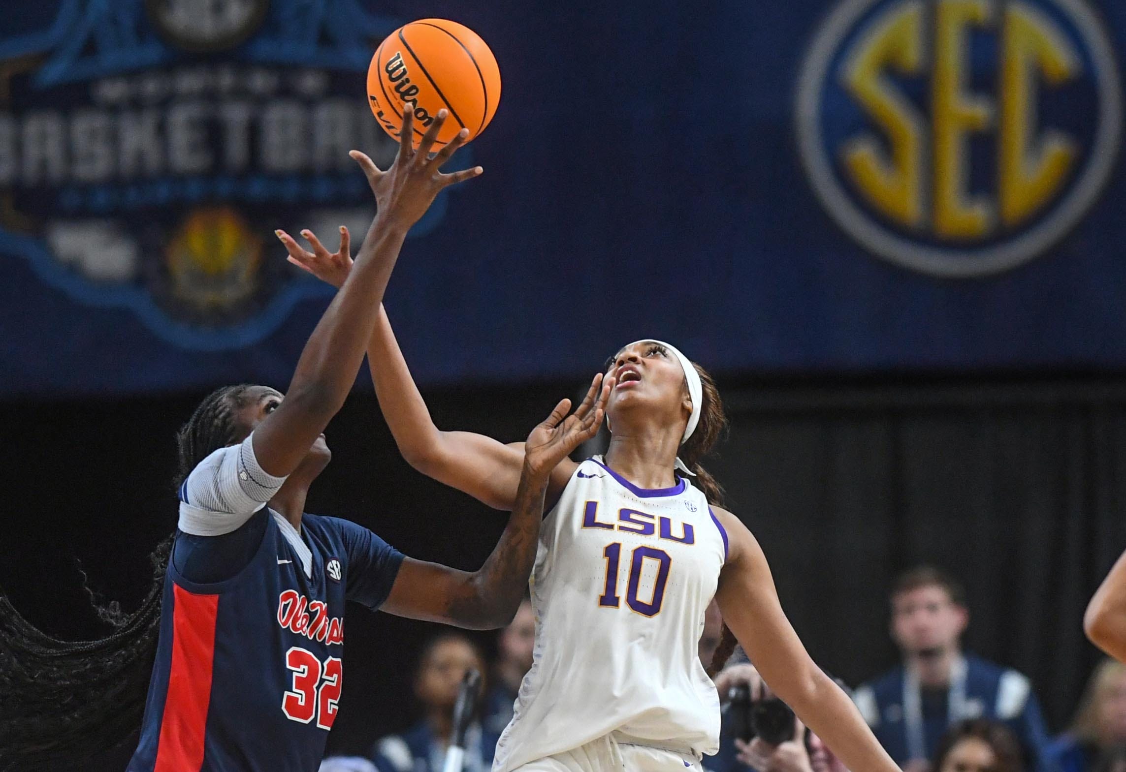Ole Miss center Rita Igbokwe (32) and Louisiana State University forward Angel Reese (10) reach for a rebound during the fourth quarter of the SEC Women's Basketball Tournament game at the Bon Secours Wellness Arena in Greenville, S.C. Saturday, March 9, 2024.