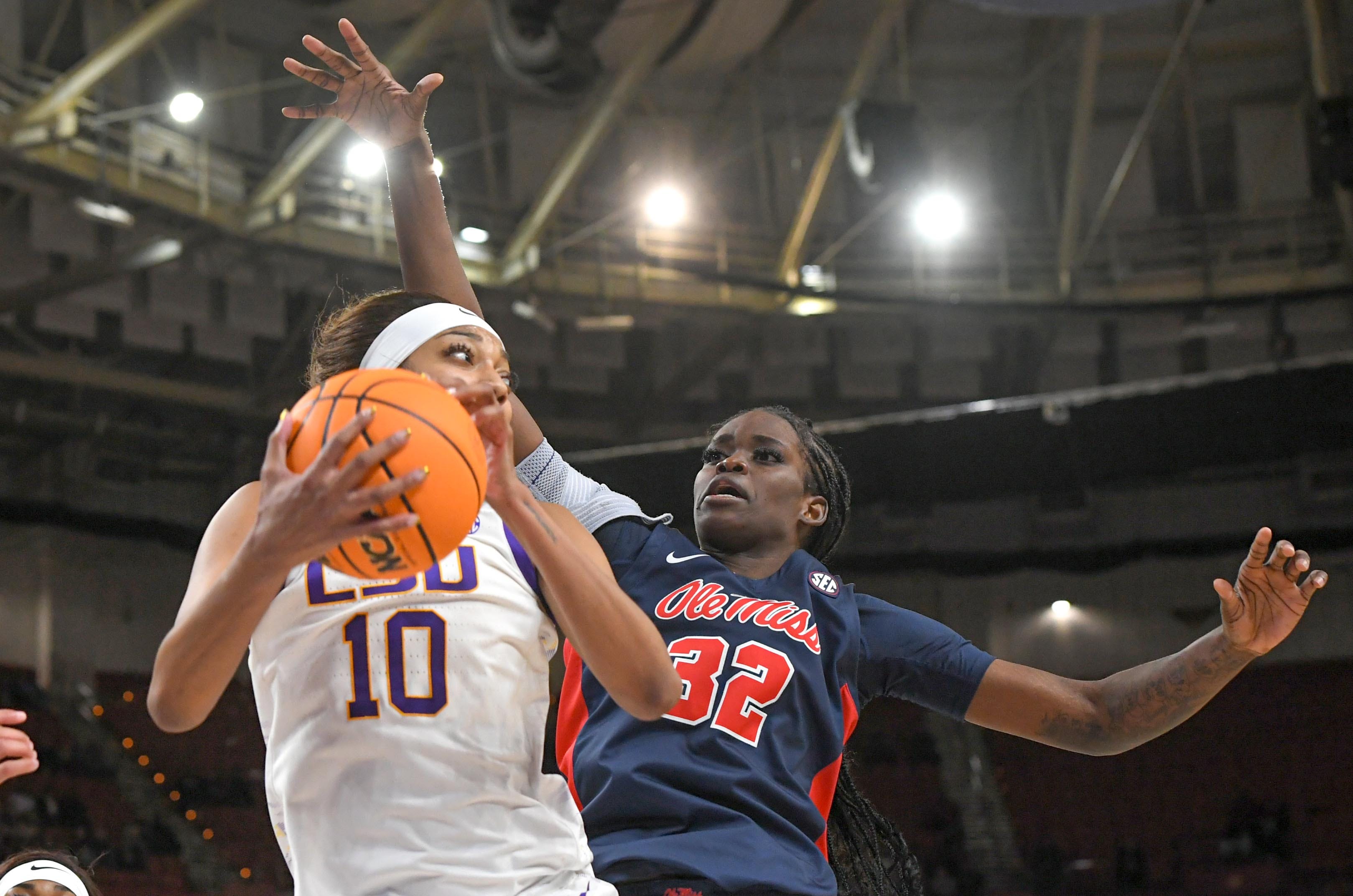 Louisiana State University forward Angel Reese (10) rebounds near Ole Miss center Rita Igbokwe (32) during the fourth quarter of the SEC Women's Basketball Tournament game at the Bon Secours Wellness Arena in Greenville, S.C. Saturday, March 9, 2024.