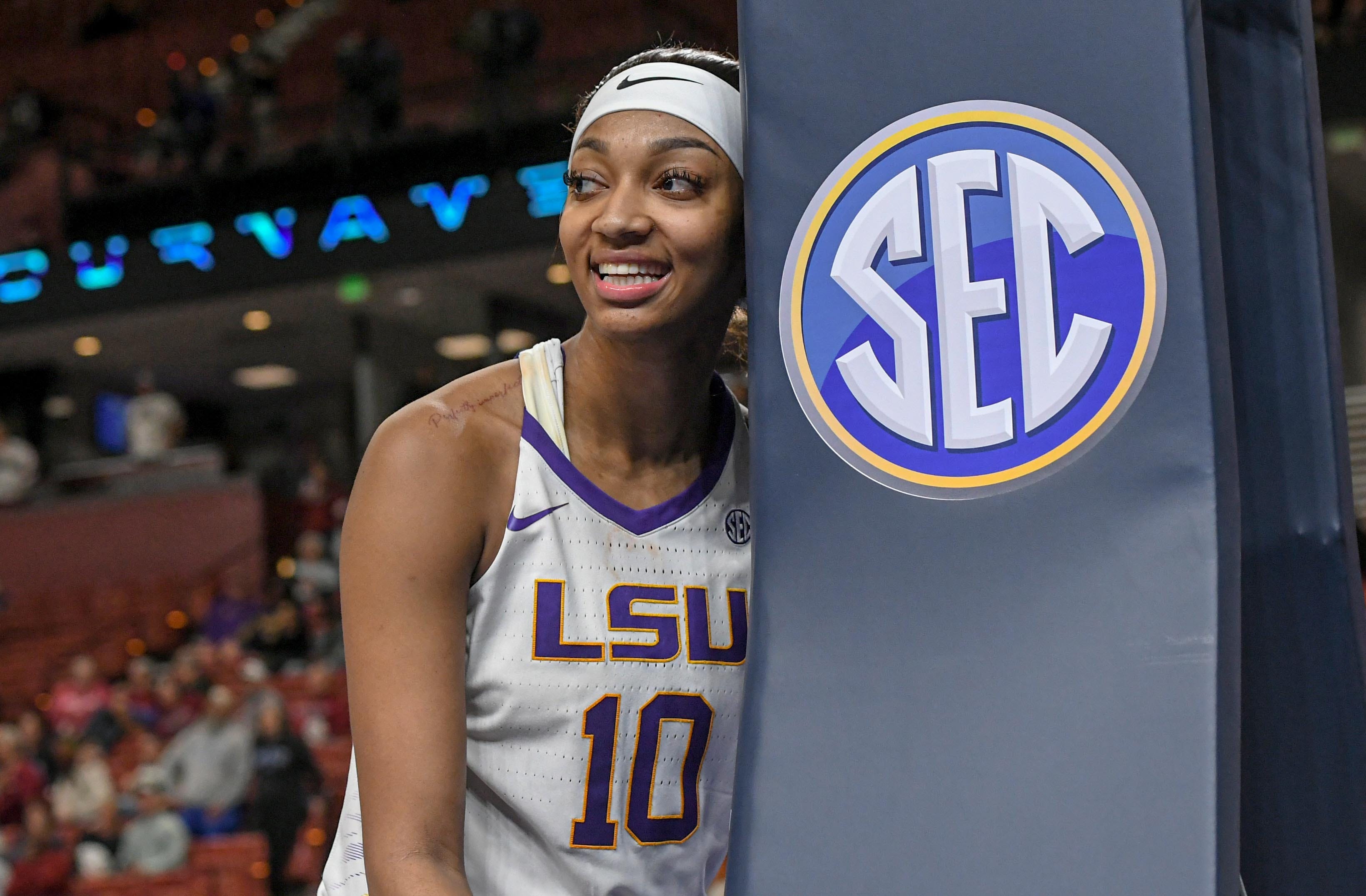 Louisiana State University forward Angel Reese (10) smiles after play late during the fourth quarter of the SEC Women's Basketball Tournament game with Ole Miss at the Bon Secours Wellness Arena in Greenville, S.C. Saturday, March 9, 2024.