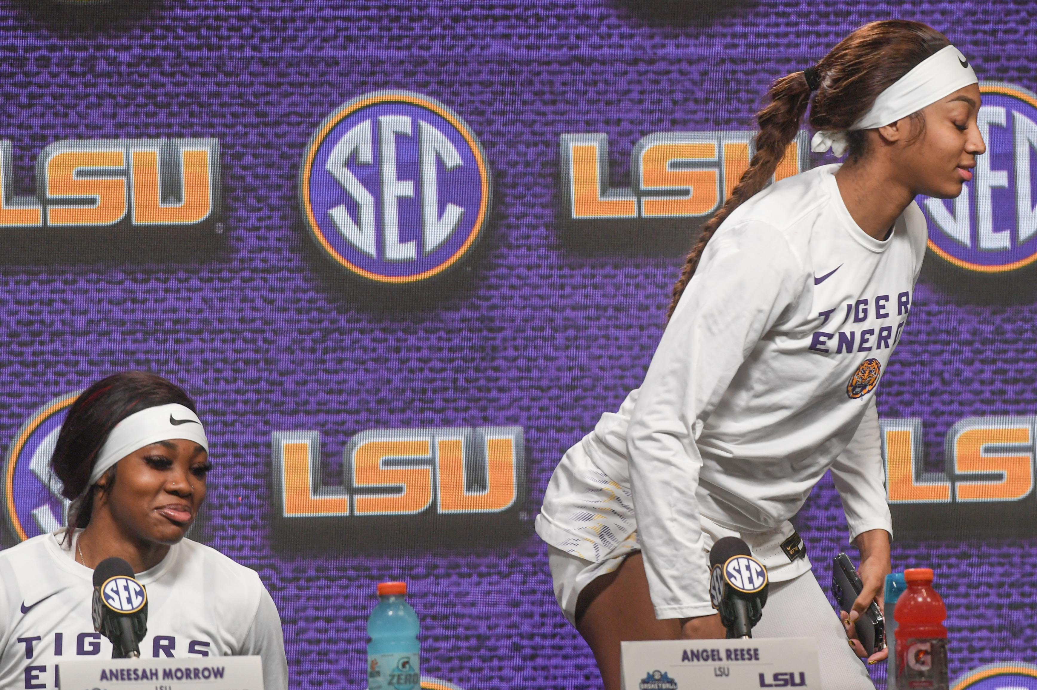 Louisiana State University forward Angel Reese, right, walks off stage after talking to media near teammate guard Aneesah Morrow, left, after LSU beat Ole Miss 75-67 at the SEC Women's Basketball Tournament game at the Bon Secours Wellness Arena in Greenville, S.C. Saturday, March 9, 2024.