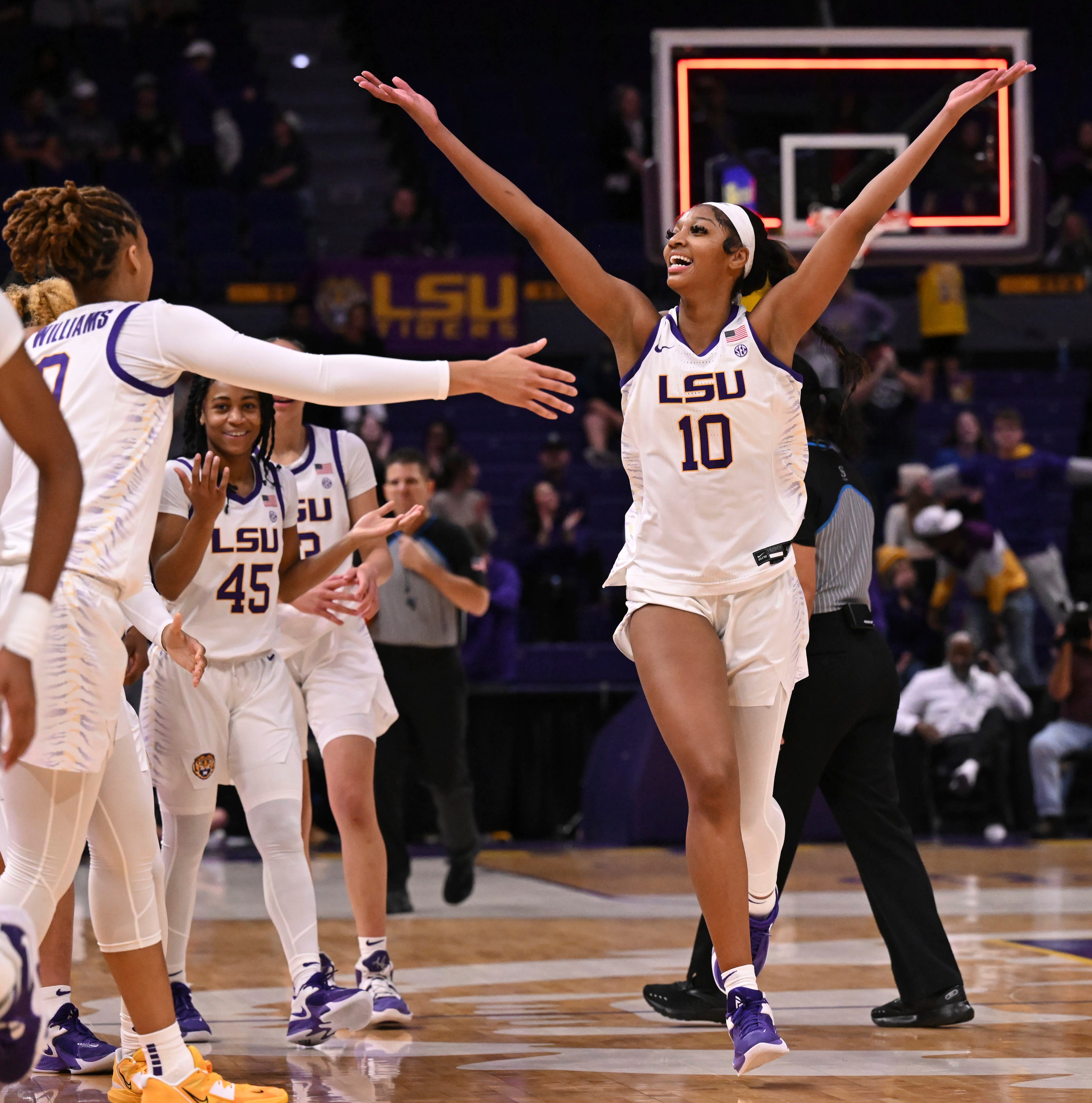 LSU forward Angel Reese (10) celebrates after making a 3-point basket against Texas A&M at the buzzer heading into halftime during an NCAA college basketball game Thursday, Jan. 5, 2023, in Baton Rouge, La. (Hilary Scheinuk/The Advocate via AP)