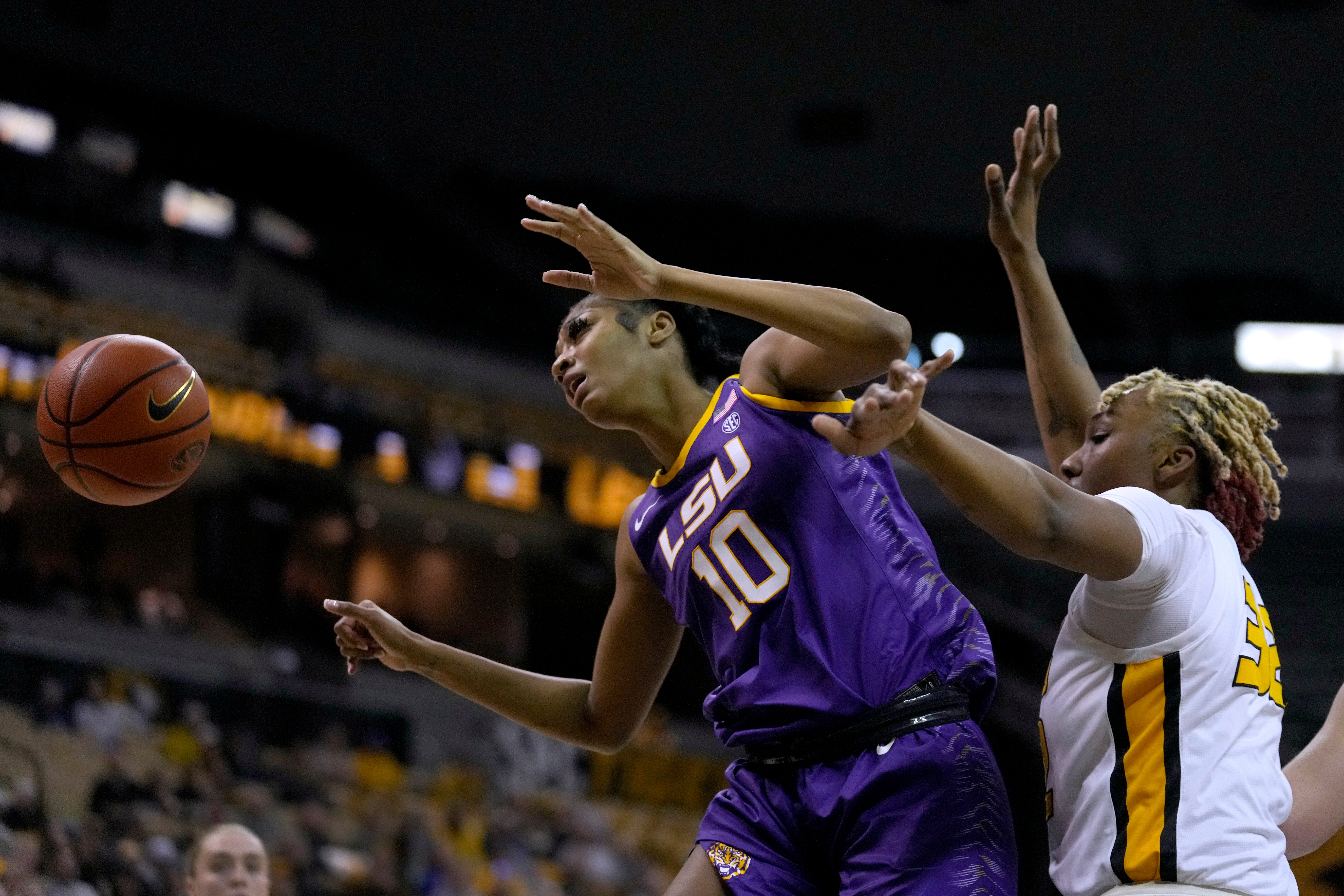 Missouri's Jayla Kelly, right, knocks the ball away from LSU's Angel Reese (10) during the second half of an NCAA college basketball game Thursday, Jan. 12, 2023, in Columbia, Mo. (AP Photo/Jeff Roberson)