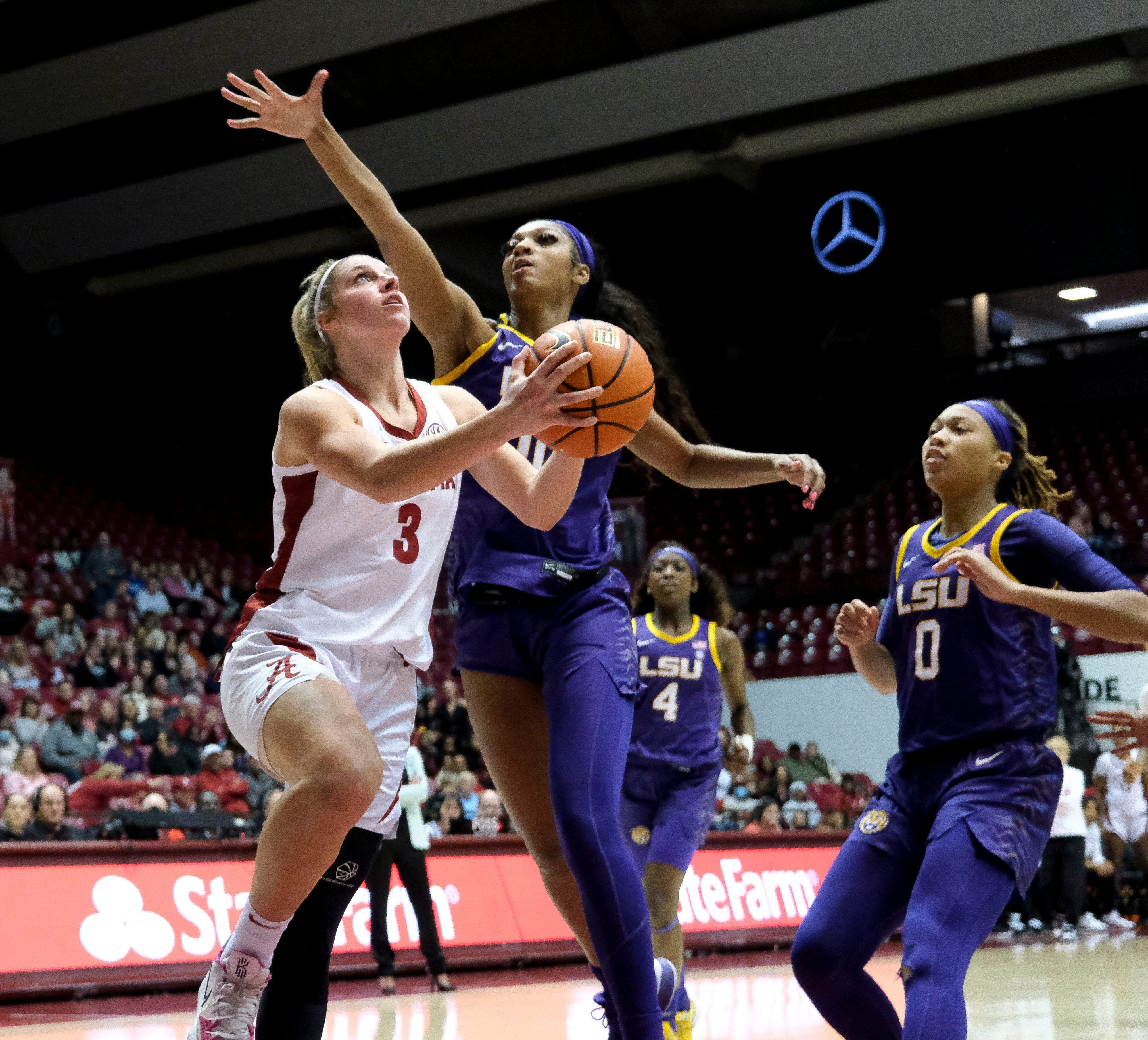 Jan 23, 2023; Tuscaloosa, AL, USA; Alabama guard Sarah Ashlee Barker (3) goes to the hoop with LSU forward Angel Reeses (10) arriving too late in Coleman Coliseum Monday night.