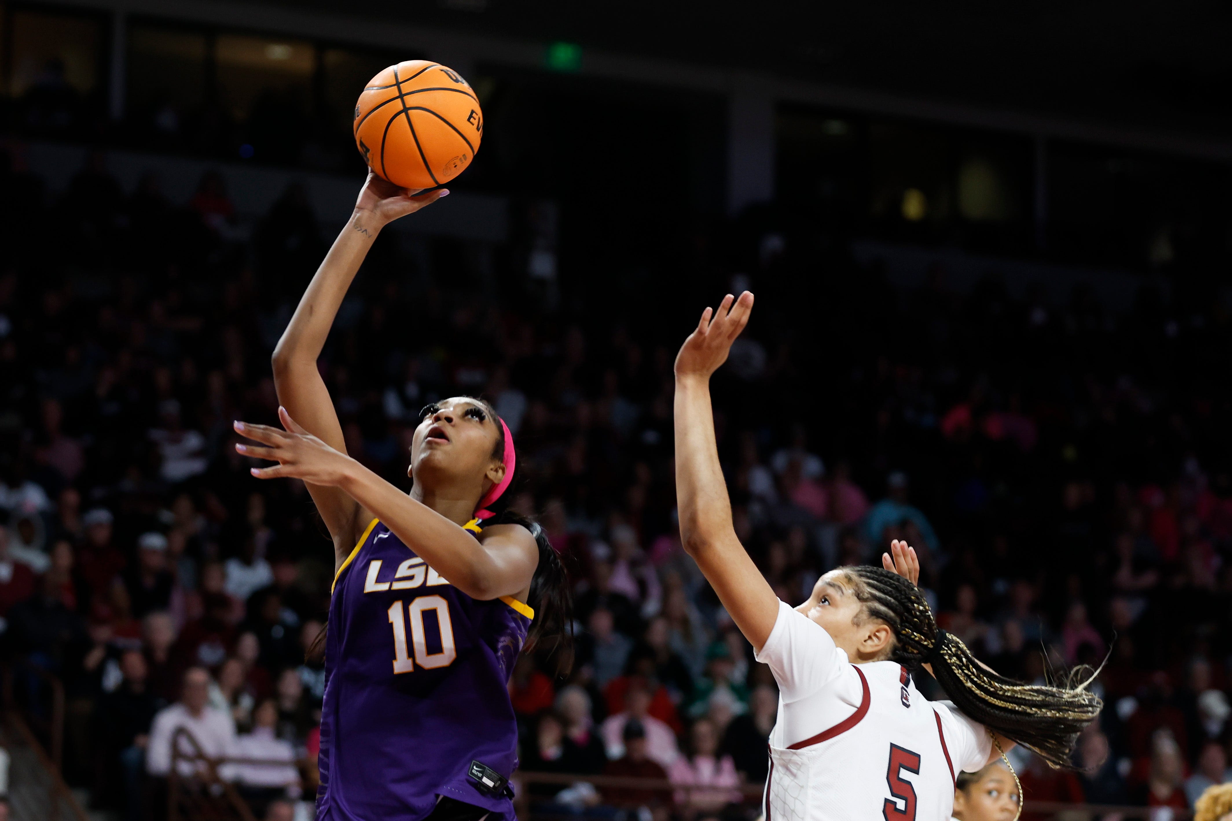 LSU forward Angel Reese (10) shoots ahead of South Carolina forward Victaria Saxton during the second half of an NCAA college basketball game in Columbia, S.C., Sunday, Feb. 12, 2023. South Carolina won 88-64. (AP Photo/Nell Redmond)