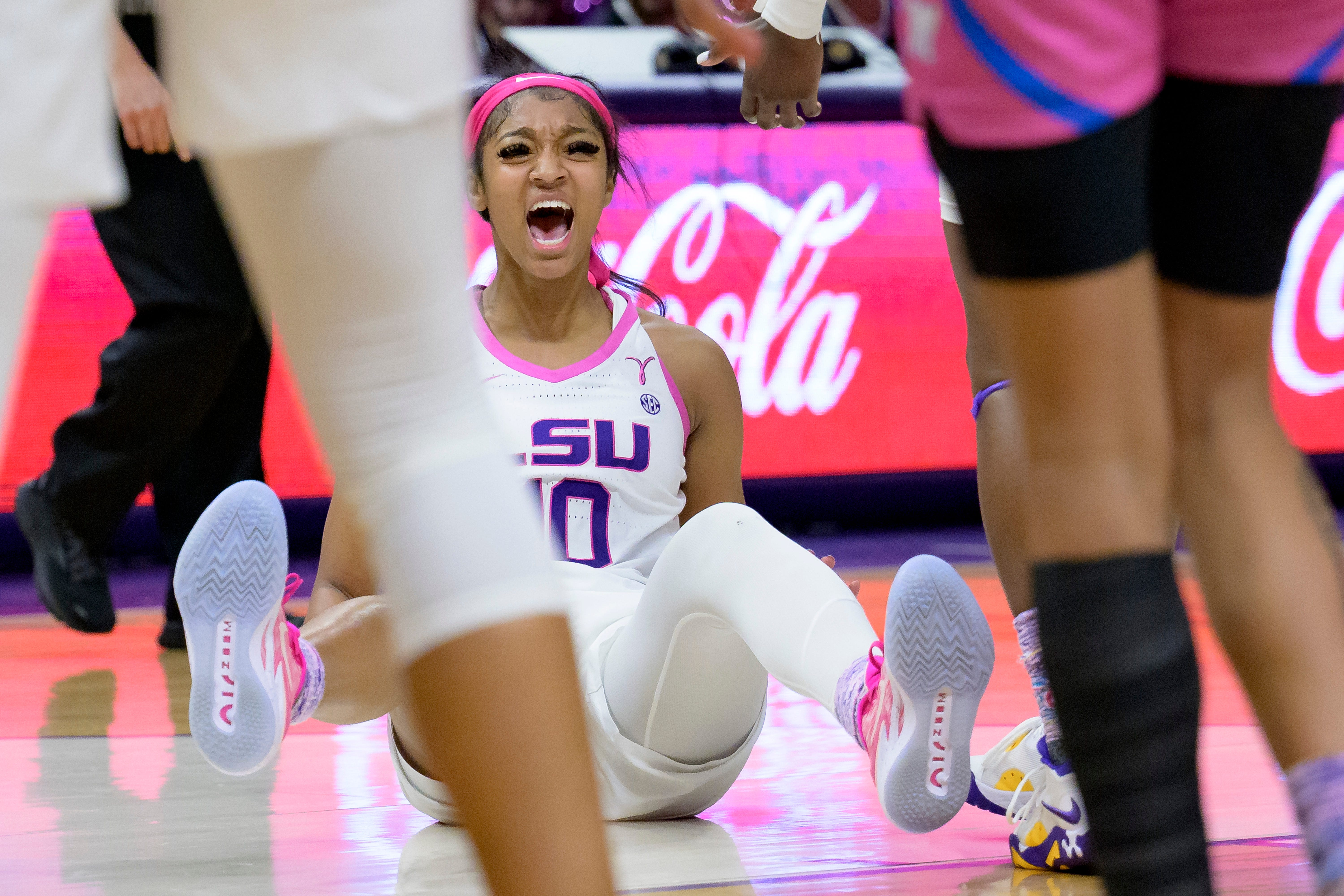 LSU forward Angel Reese (10) slaps her hands on the floor after scoring a basket and getting fouled for an additional free throw shot in the second half of an NCAA college basketball game against Mississippi, Thursday, Feb. 16, 2023, in Baton Rouge, La. (AP Photo/Matthew Hinton)