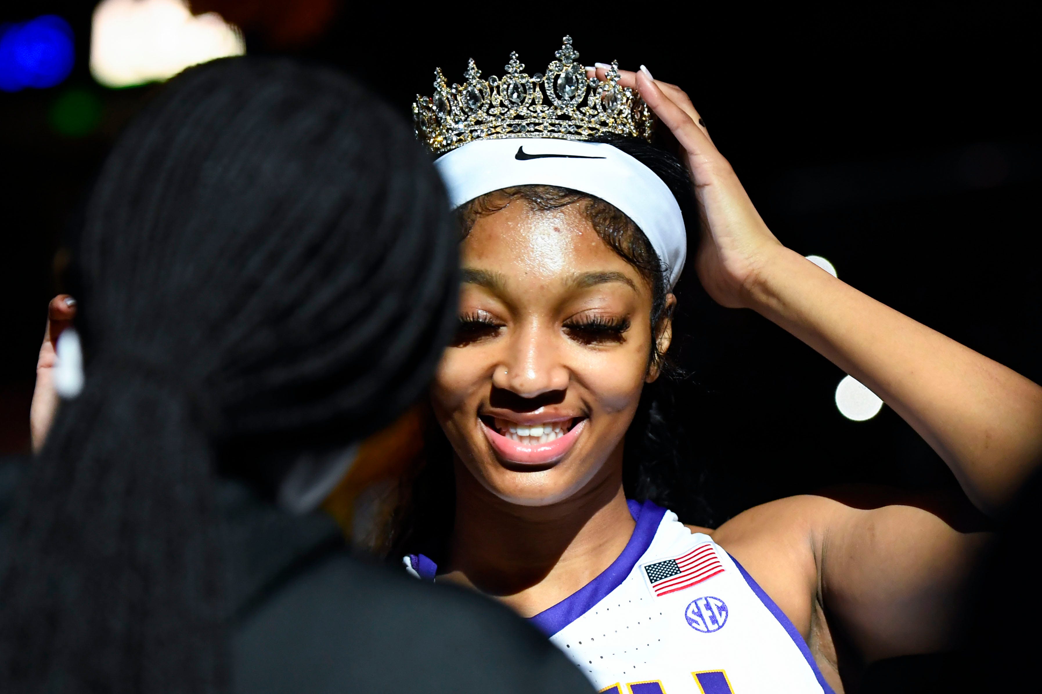 Louisiana State University forward Angel Reese (10) or the "Bayou Barbie" puts on her crown while being introduced before the NCAA Women's Greenville Regional Elite Eight Basketball Tournament against Miami at Bon Secours Wellness Arena in Greenville, S.C. Sunday, March 26, 2023.