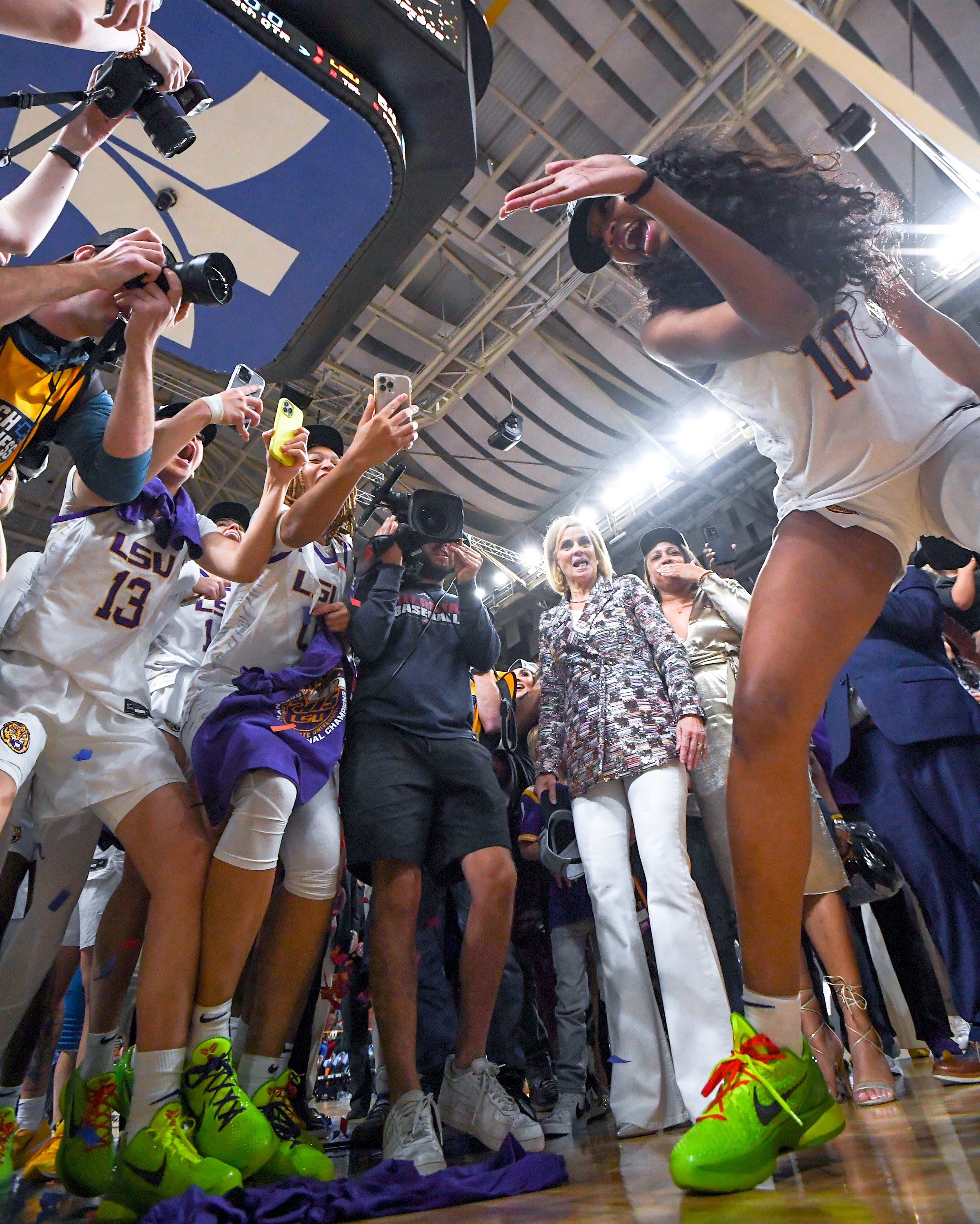 Louisiana State University forward Angel Reese (10) celebrates with teammates after they beat Miami the Elite Eight NCAA Women's Basketball Tournament game at the Bon Secours Wellness Arena in Greenville, S.C. Sunday, March 26, 2023. LSU won 54-42.
