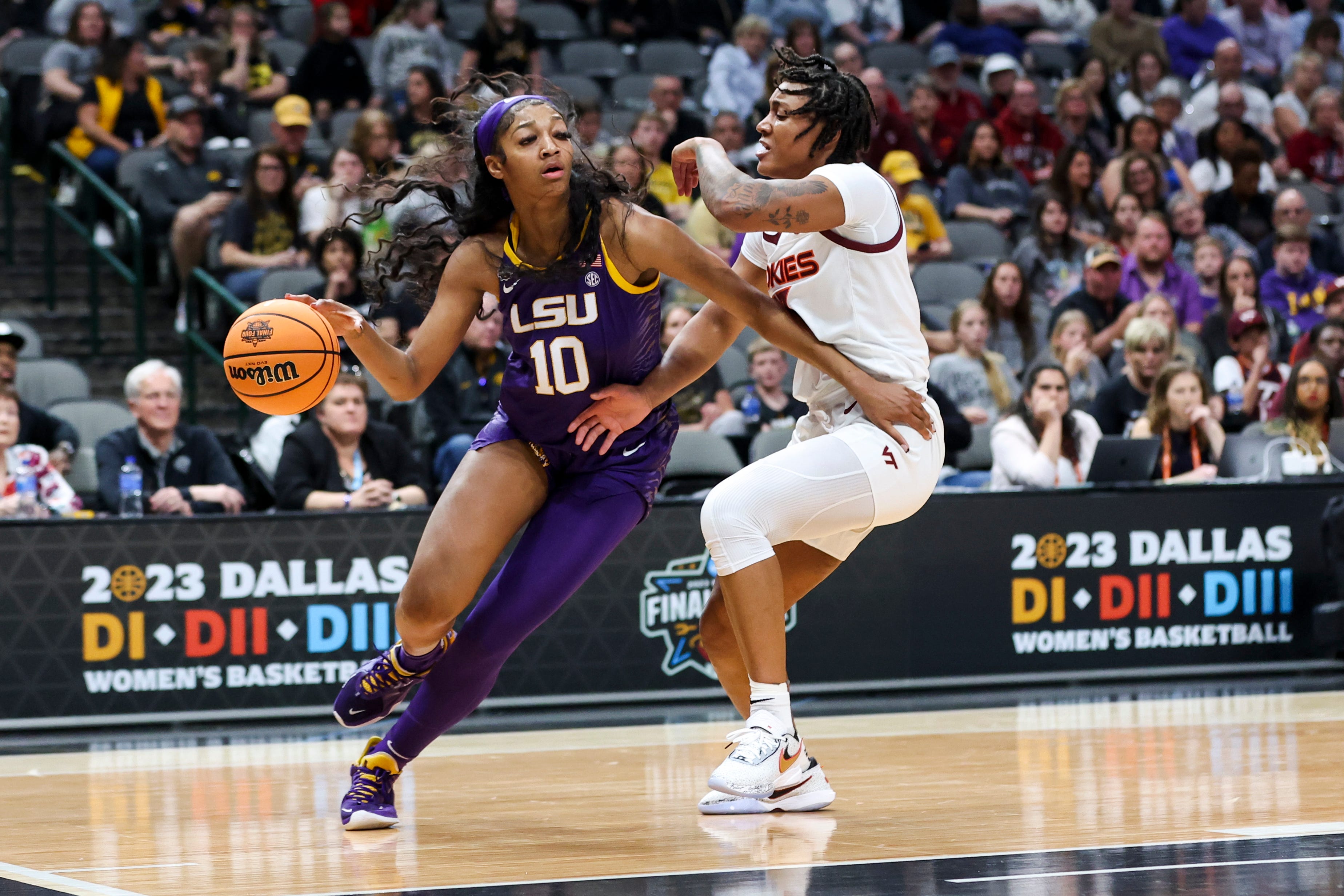 Mar 31, 2023; Dallas, TX, USA; LSU Lady Tigers forward Angel Reese (10) drives to the basket against Virginia Tech Hokies forward Taylor Soule (13) in the first half in semifinals of the the women's Final Four of the 2023 NCAA Tournament at American Airlines Center. Mandatory Credit: Kevin Jairaj-USA TODAY Sports