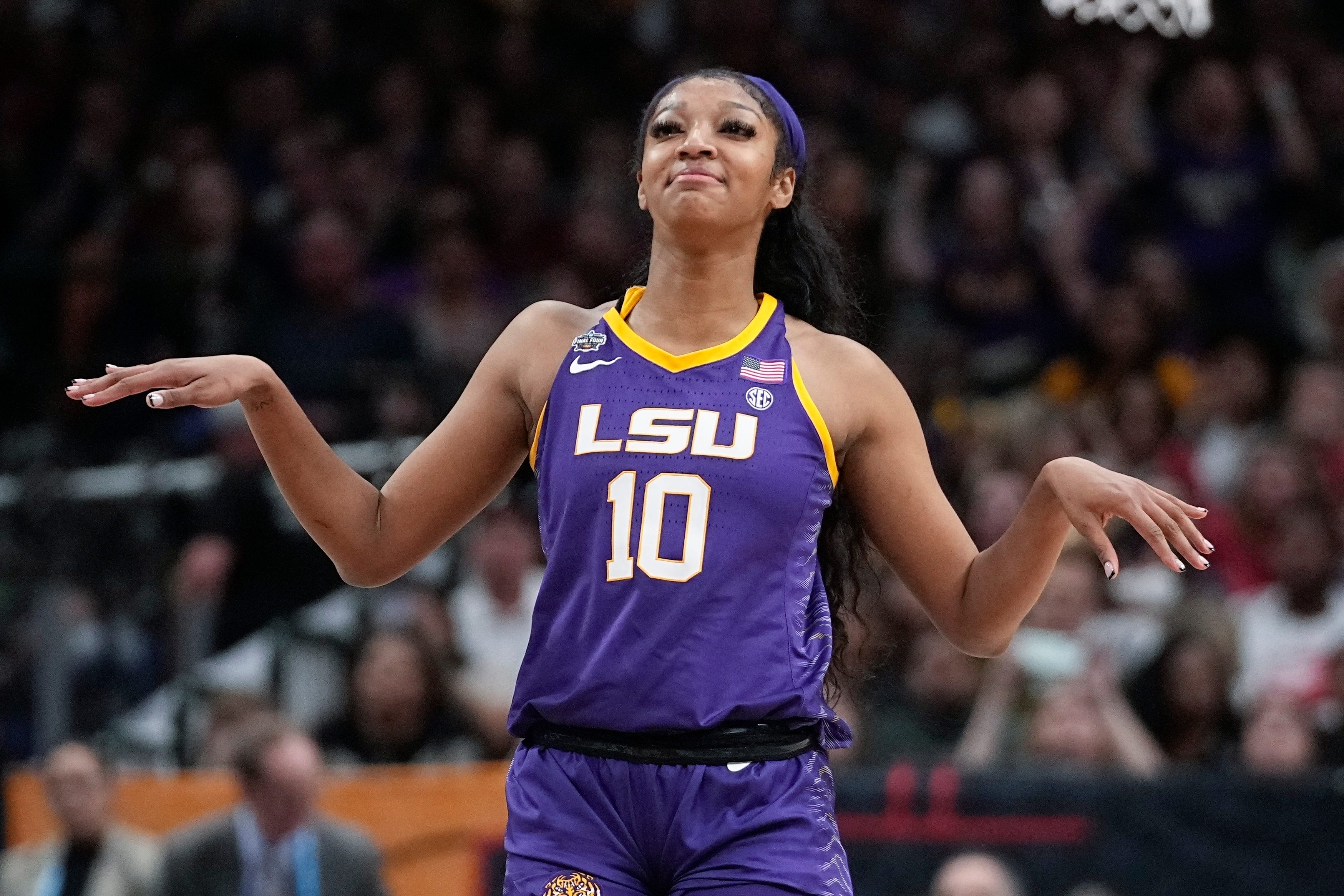 LSU's Angel Reese celebrates after an NCAA Women's Final Four semifinals basketball game against Virginia Tech Friday, March 31, 2023, in Dallas. LSU won 79-72 to advance to the championship game on Sunday. (AP Photo/Darron Cummings)